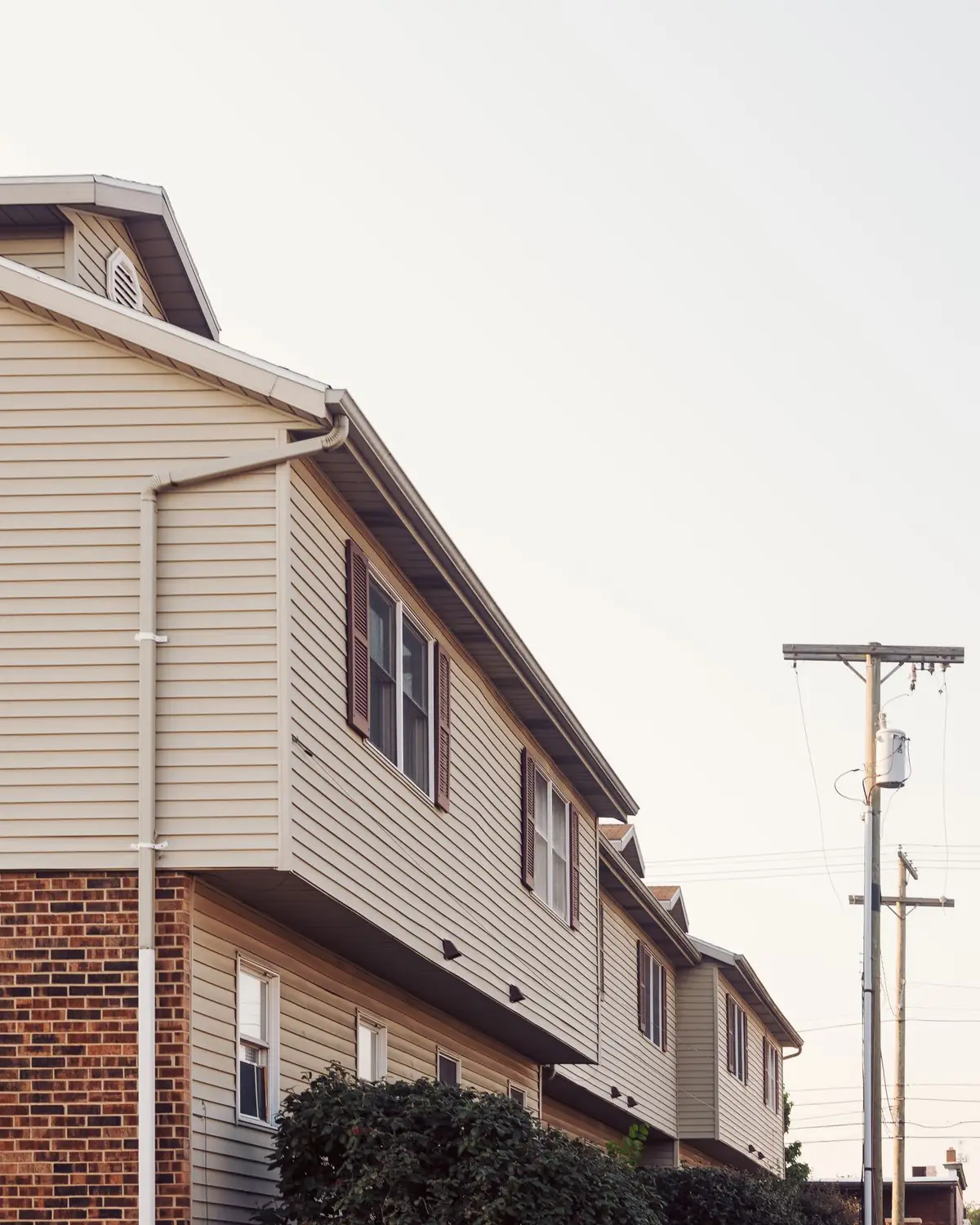 Contemporary suburban row houses with brick and siding