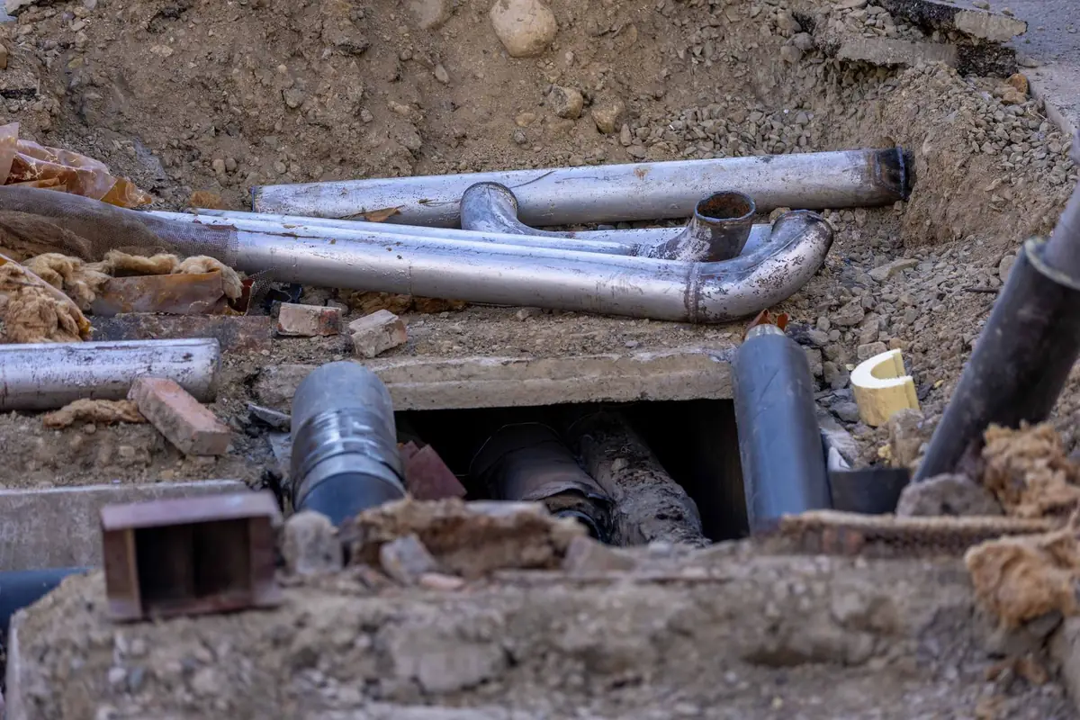 Pipes exposed in an excavated trench