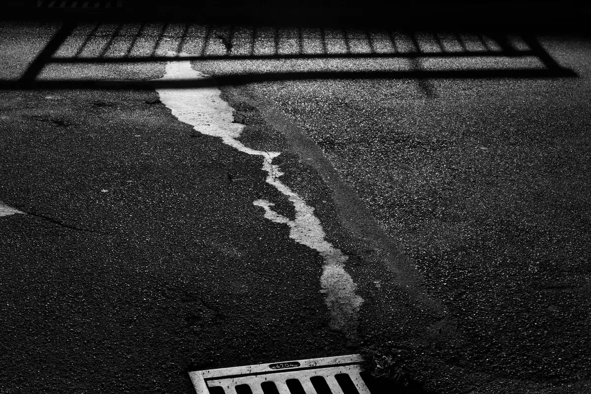 Round metal drain cover in a floor